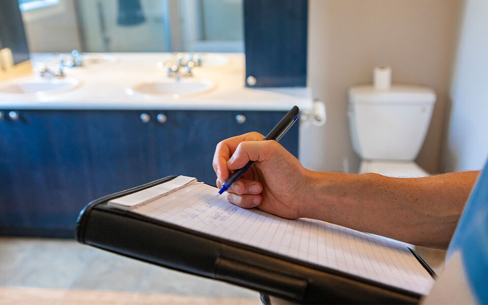 man completing new build snagging survey